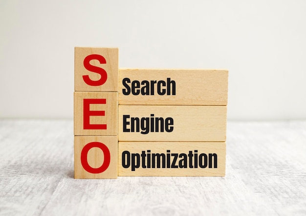 Wooden blocks arranged to display various SEO-related words and phrases.